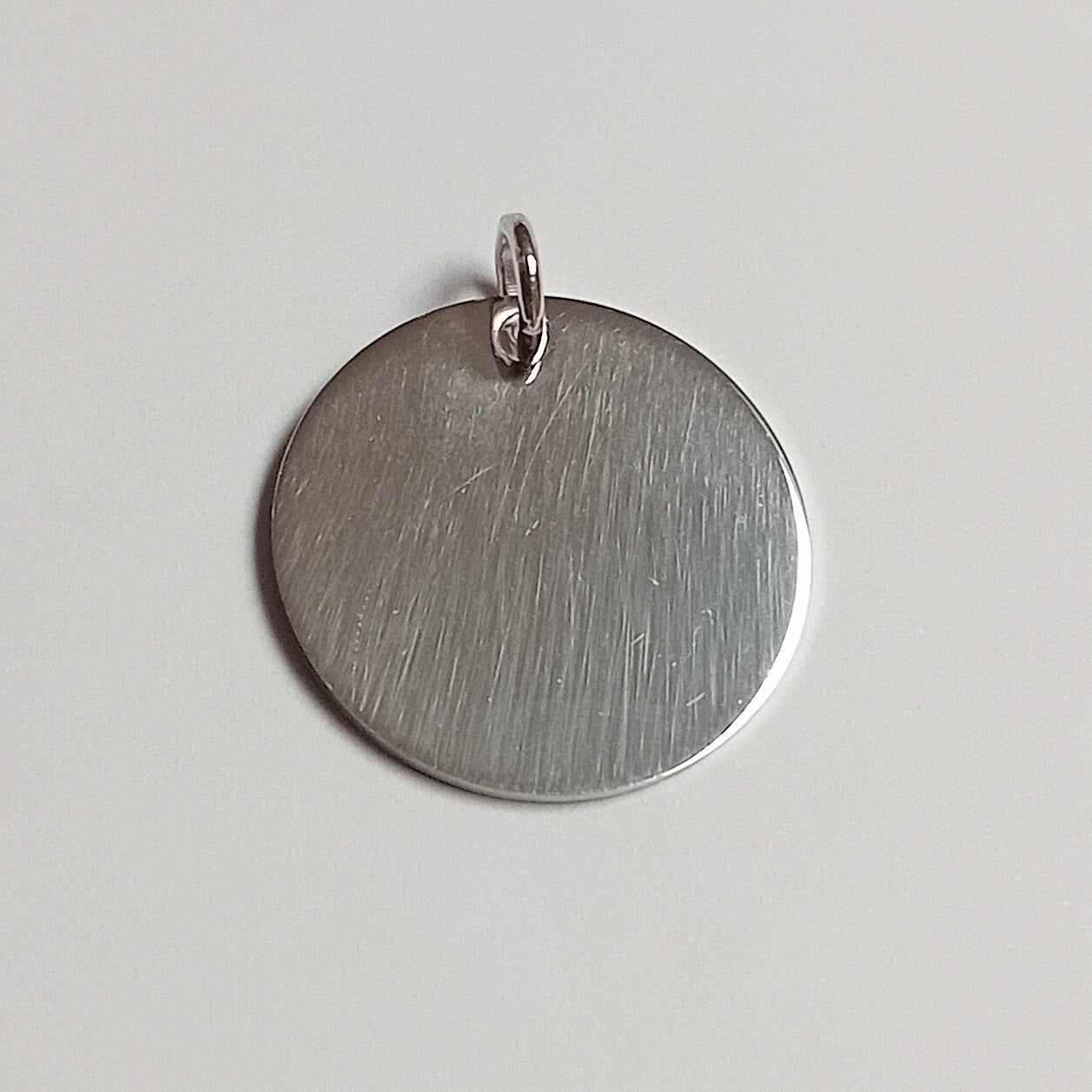 Piastrina tonda argento 925 rodiato